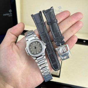 Đồng Hồ Nữ Patek Philippe Nautilus 7010/1G-012 Mặt Xám Khói Viền Đá Rep 1:1 Máy Pin 32mm